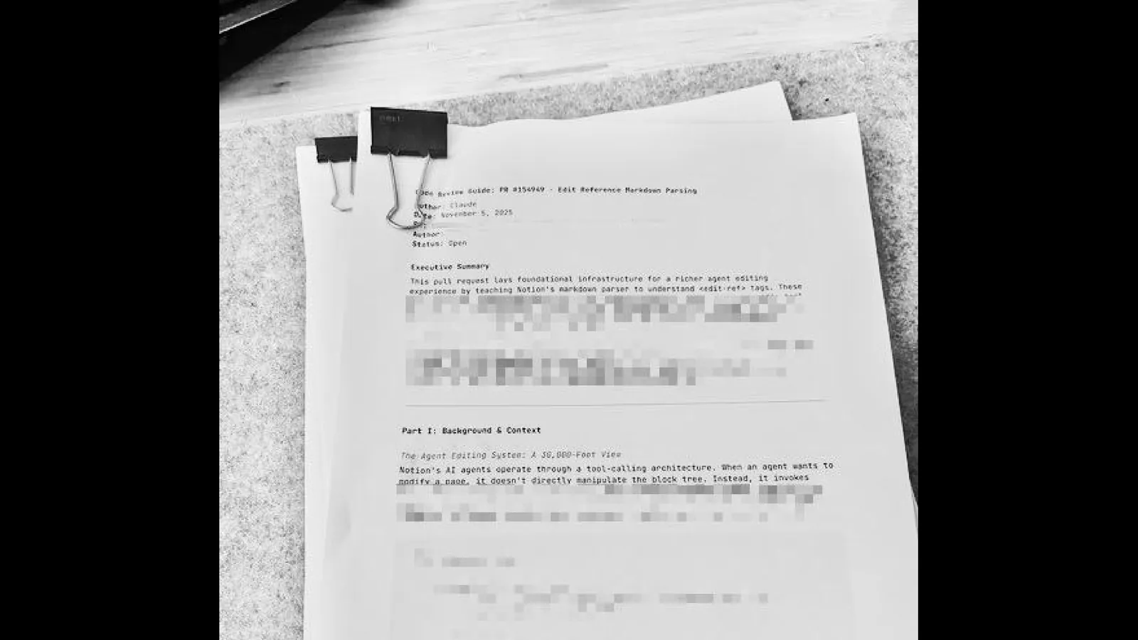 Photo of a printed code explainer packet at a café.
